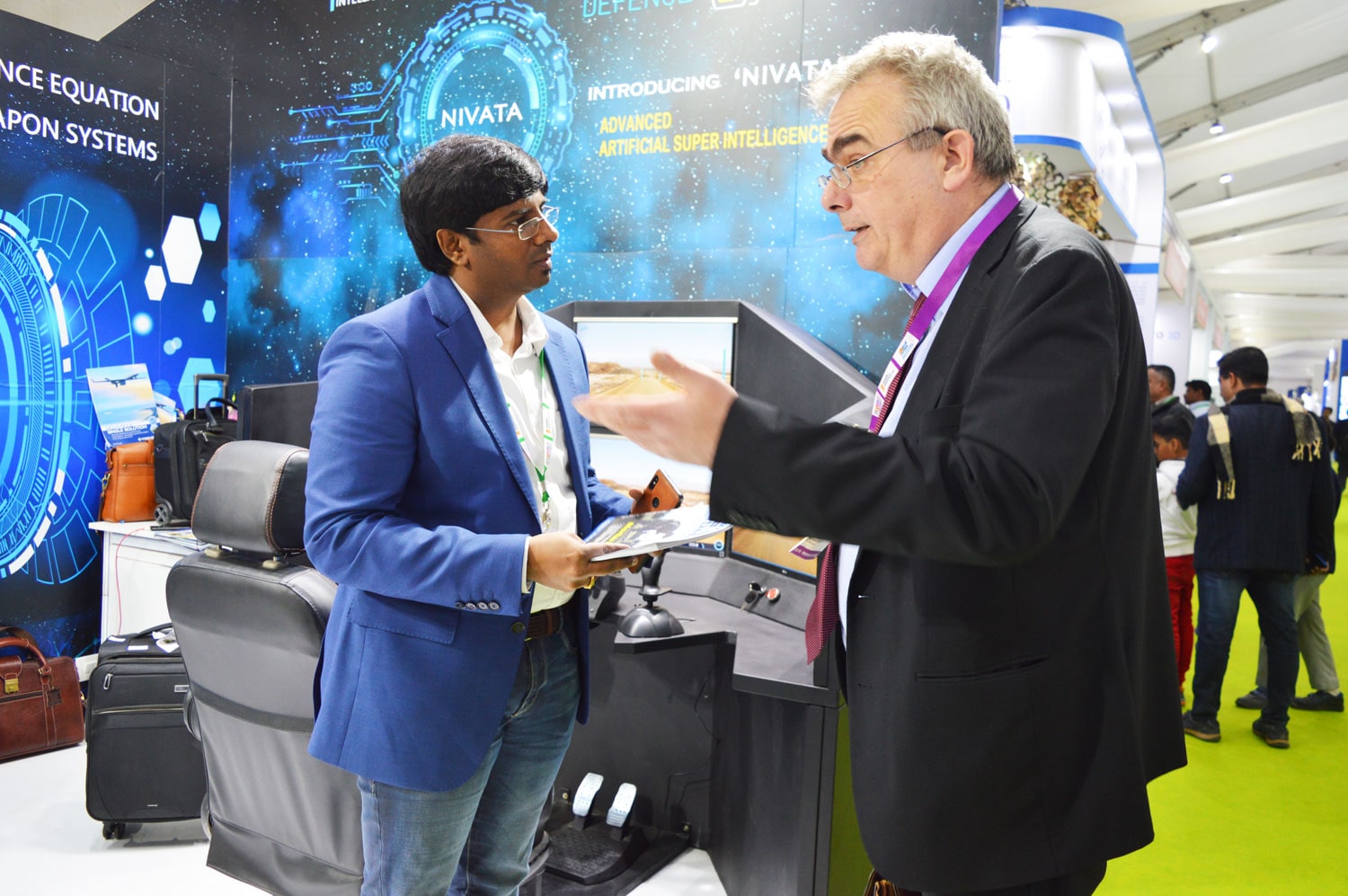 International Business visitors are impressed seeing the India’s Unmanned Armoured Vehicle SOORAN displayed by Defence Master